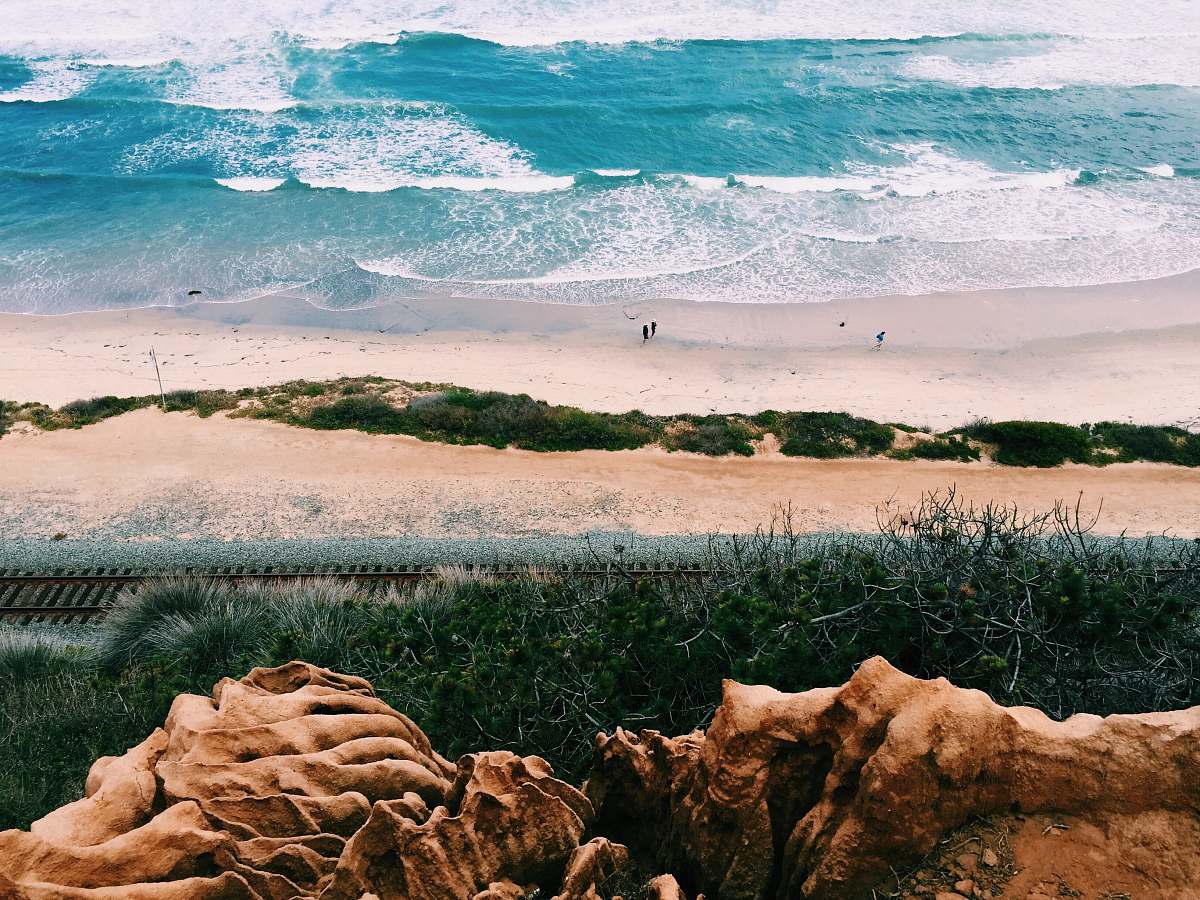san diego person walking on beach shore during daytime ground